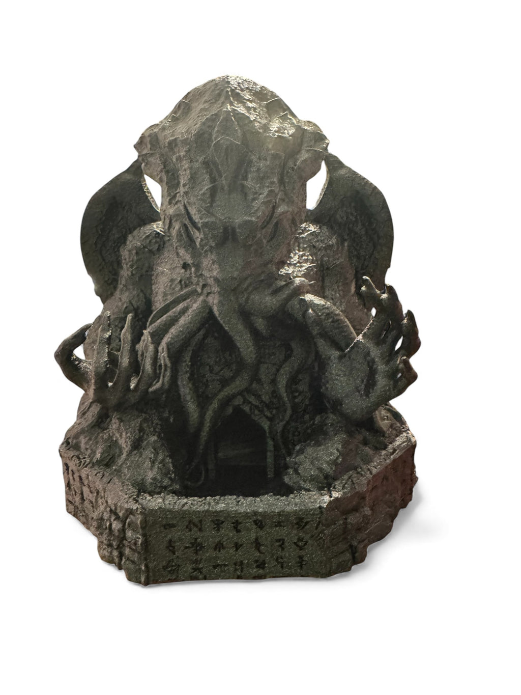 A Cthulhu dice tower on a white background
