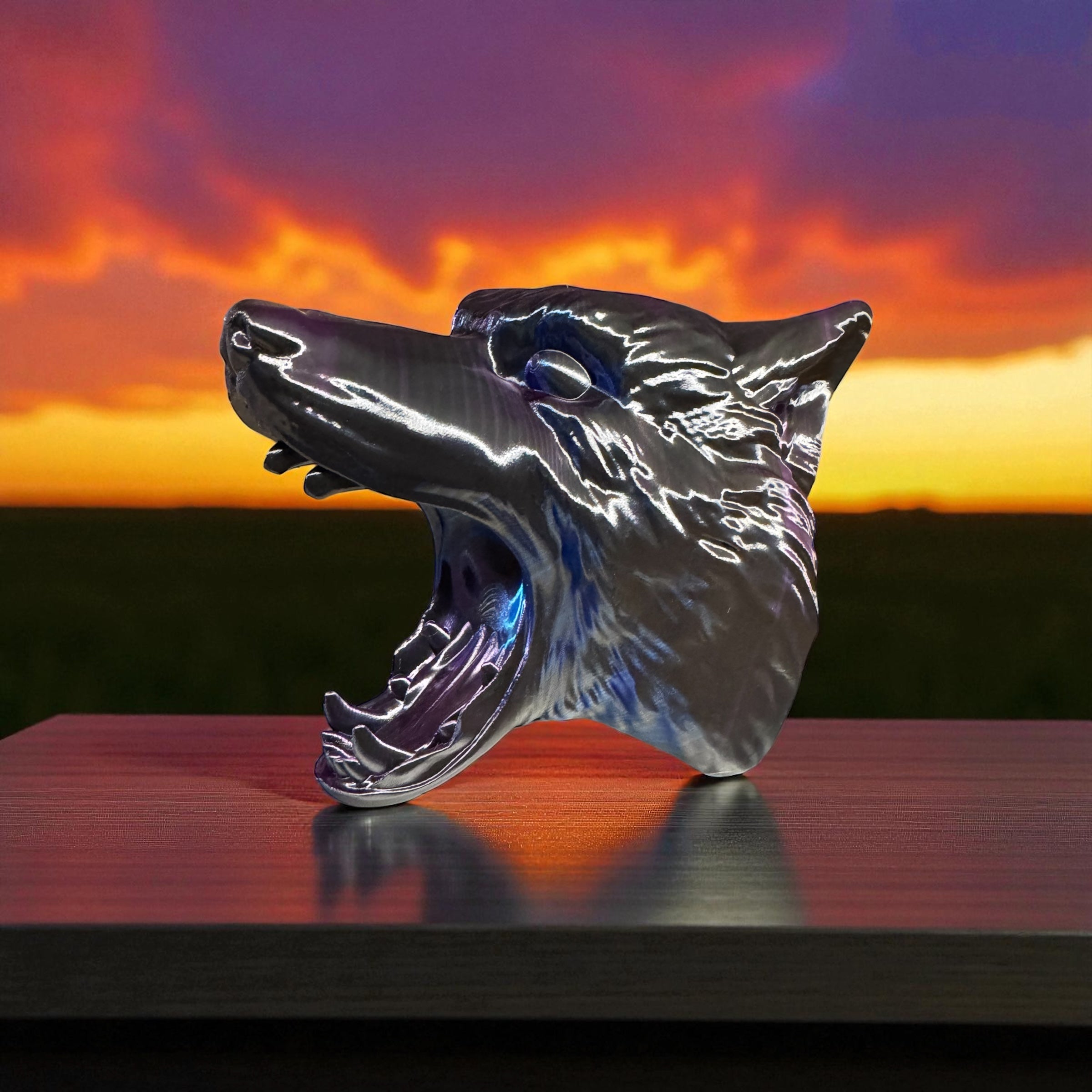 A 3D printed wolf head with a sunset background