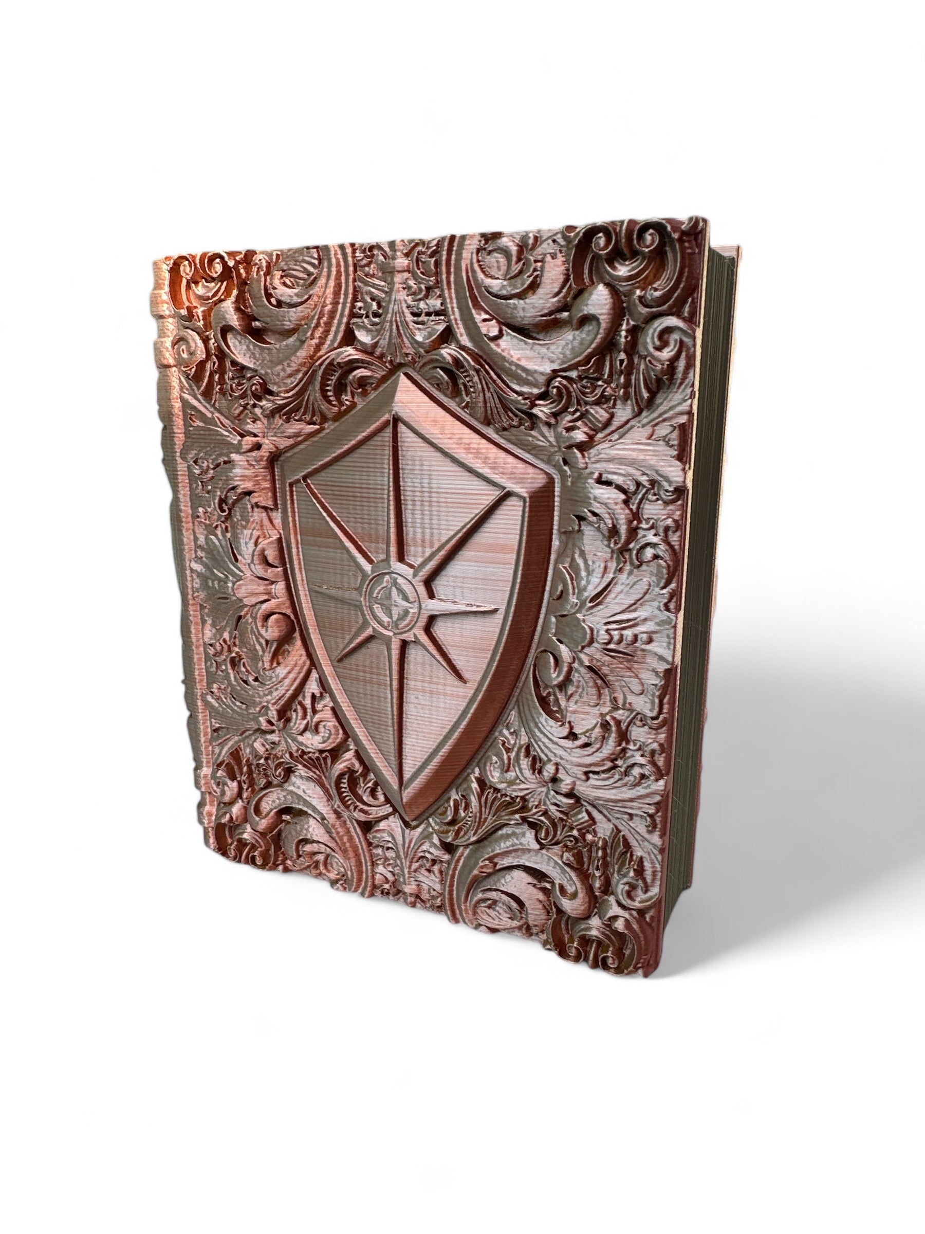 A 3D printed, multicolored dice tray with intricate designs and a shield emblem in the center, known as The Paladins Tome.