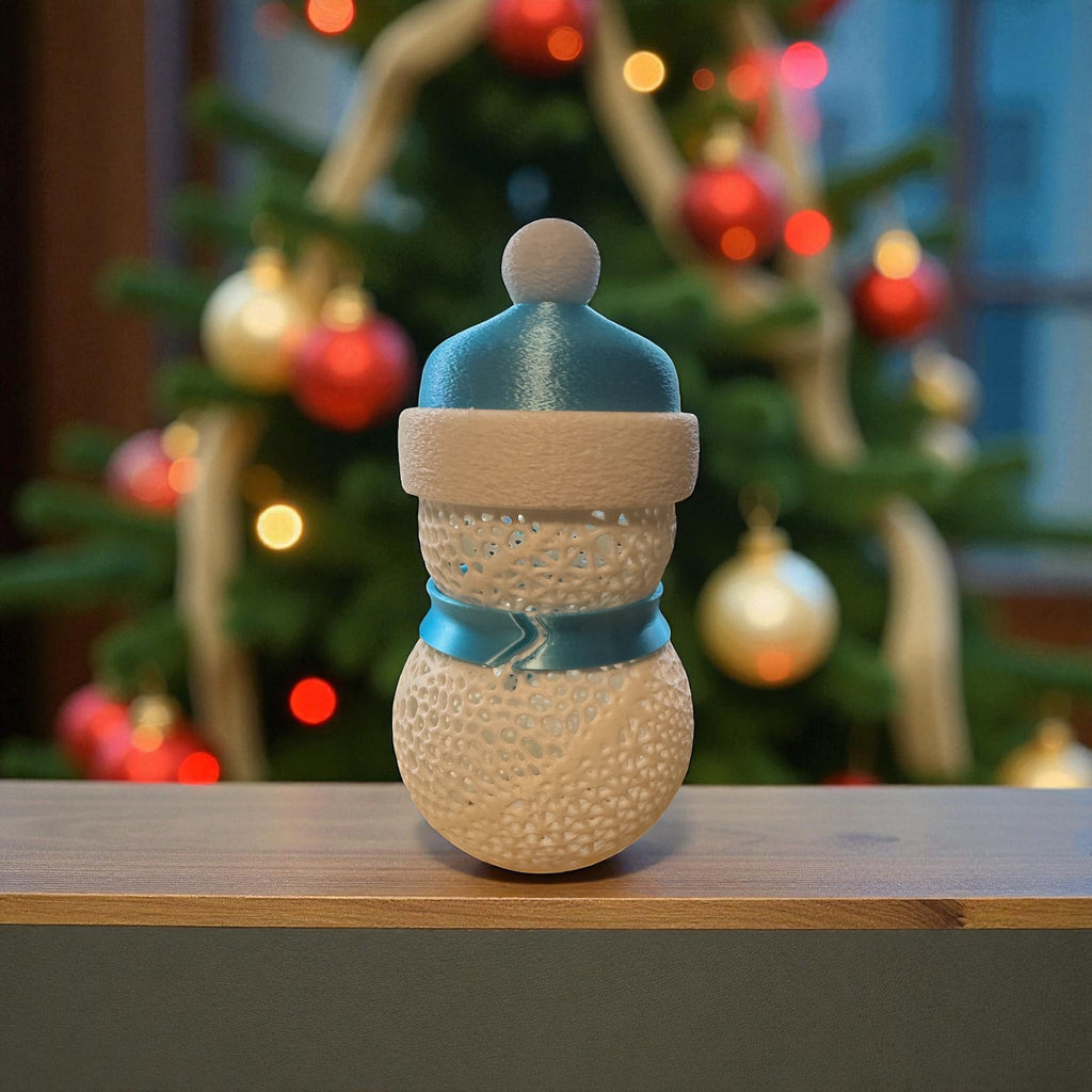 Decorative snowman figurine with a blurred Christmas tree in the background